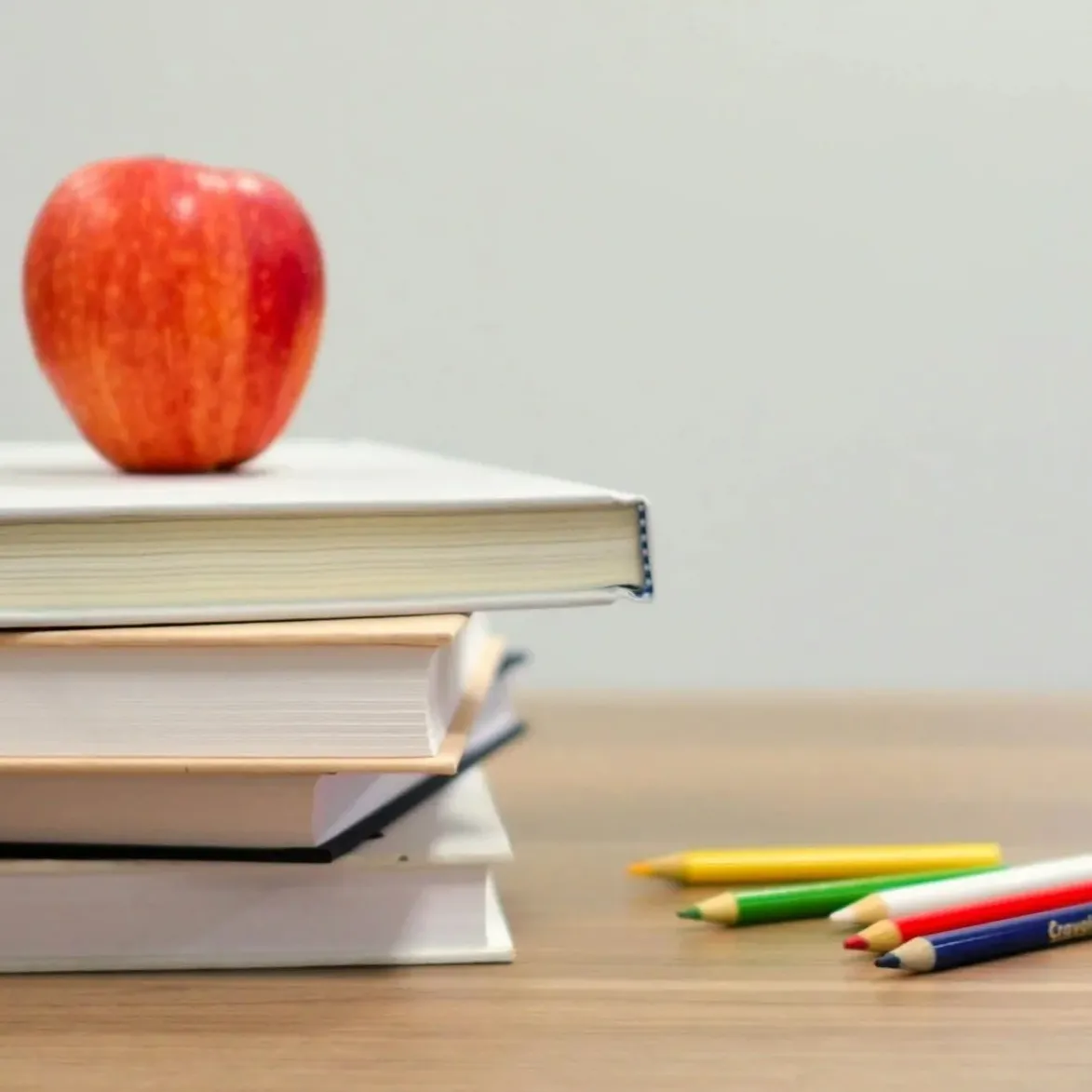 Image of apple with books